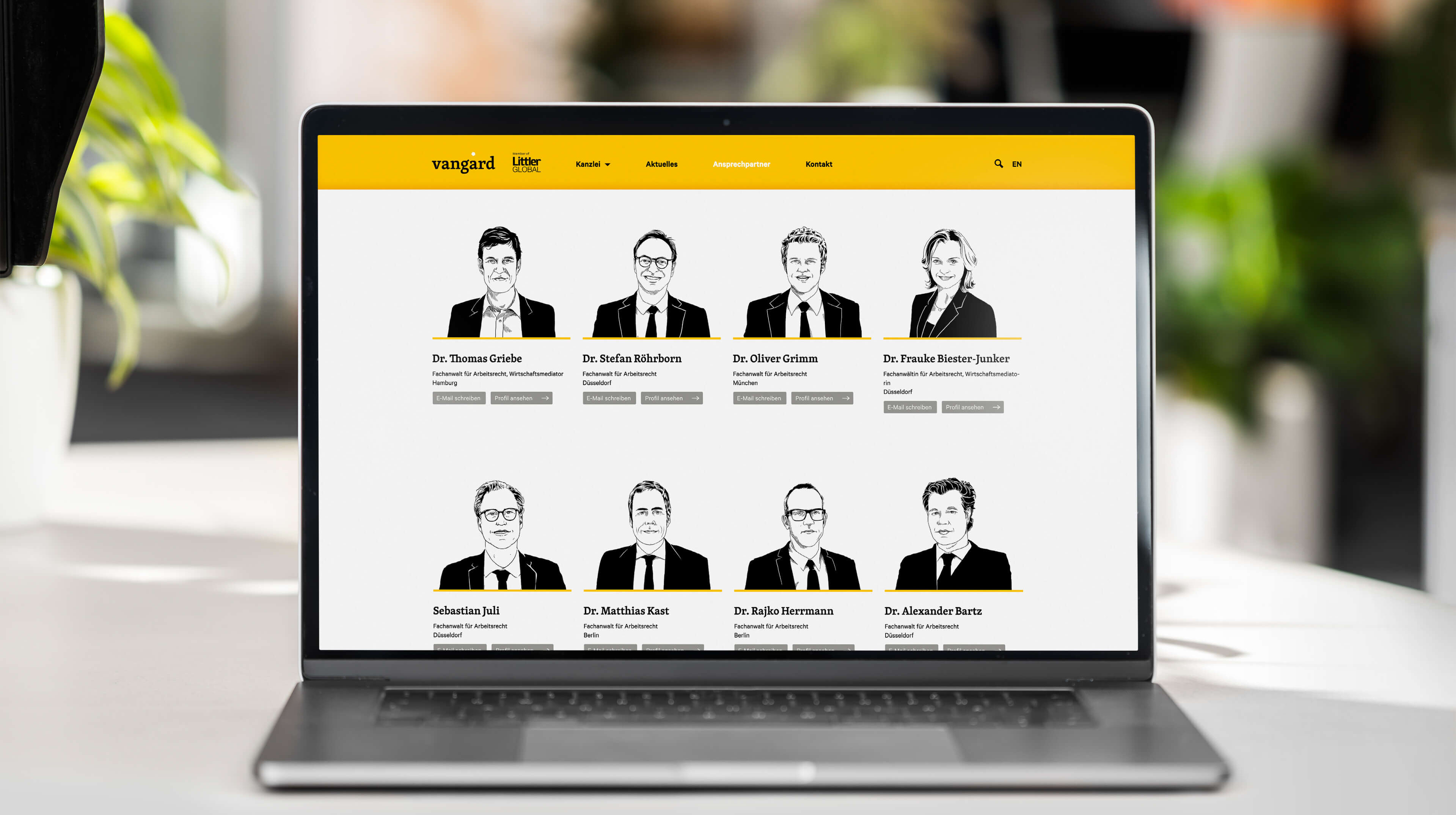 Die vangard Website mit Porträt-Illustrationen auf einem Laptop